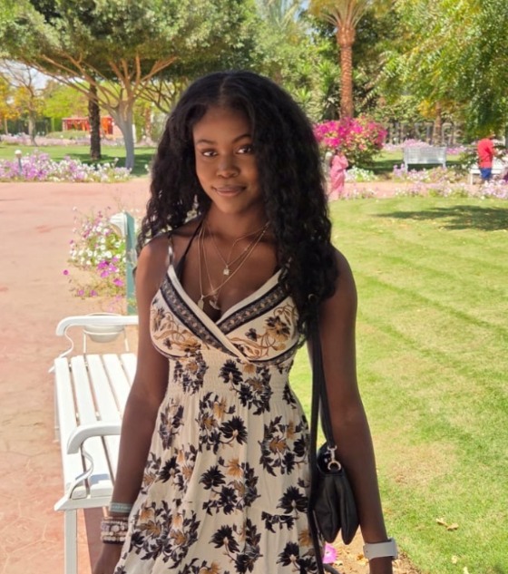 Jess in a sunny garden in Dubai
